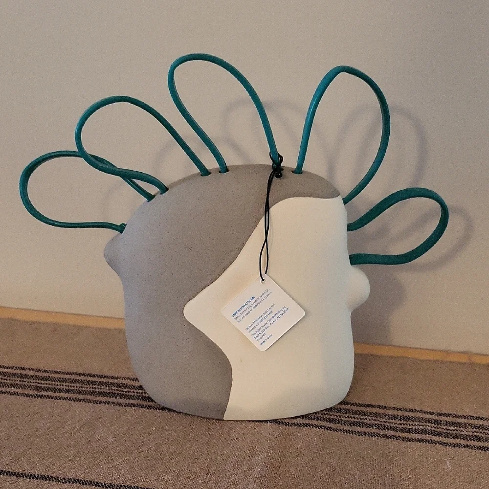 Abstract Face Aquarium Decor with Teal Accents
